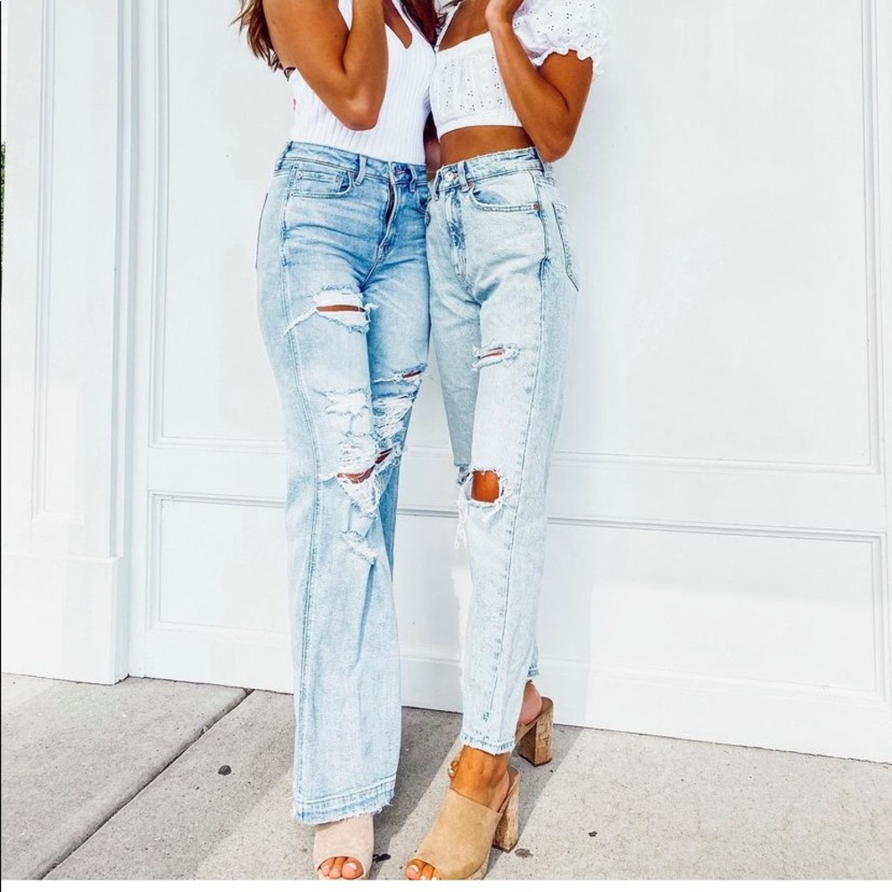 Straight leg distressed jeans (left side)